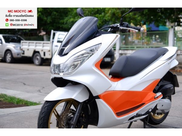 pcx ขาวส้ม ชุดสีสดสวยมาก ไม่มีรอยล้มชน มีเล่มชุดโอนครบ ภาษีไม่ขาด    19 รูปที่ 0